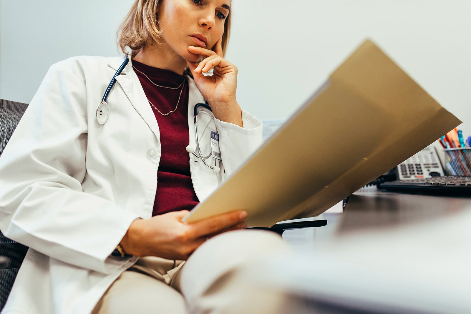 Doctor Reading Medical Documentation
