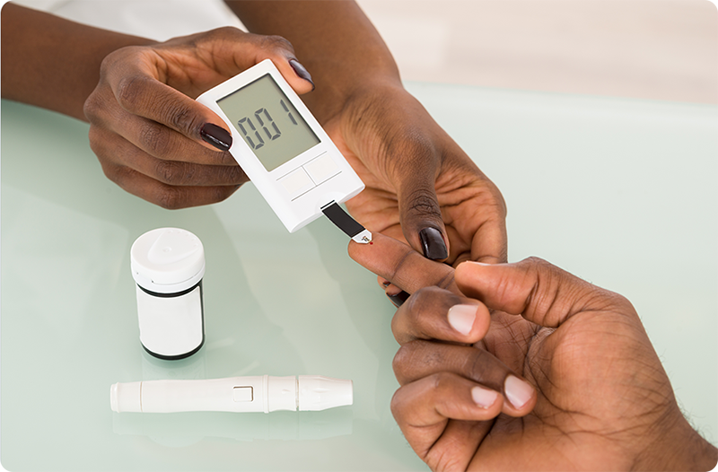 Patient having their blood sugar level checked